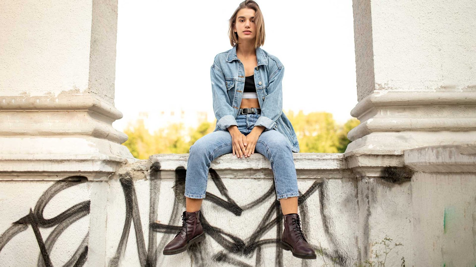 girl dressed in denim look and boots.