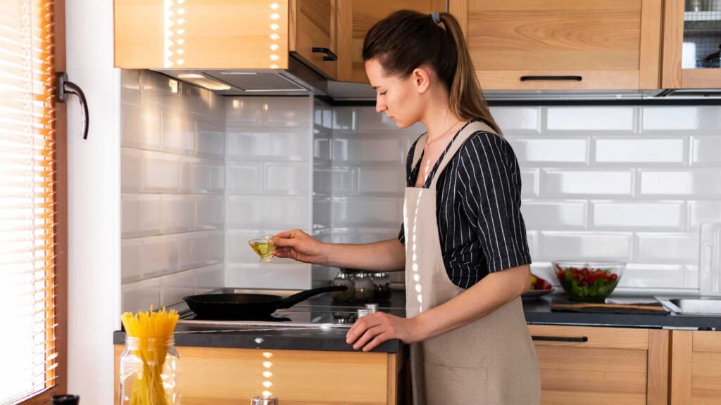 woman kitchen cooking in pan.